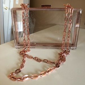 Acrylic and rose gold clutch